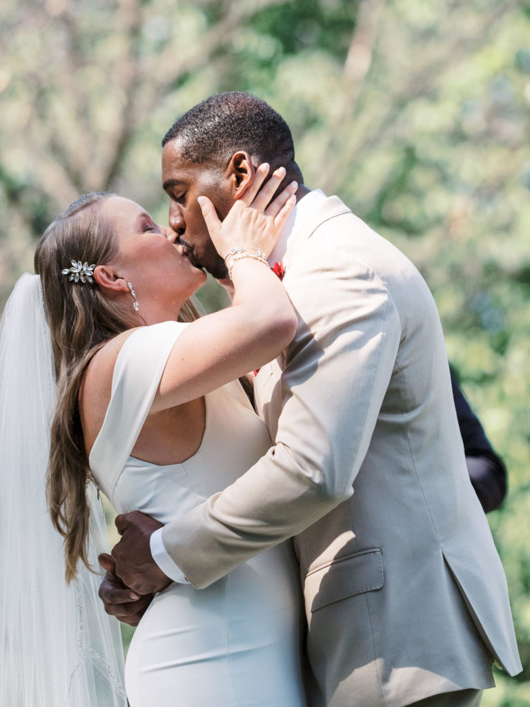 The first kiss—the bride and groom are officially married!
