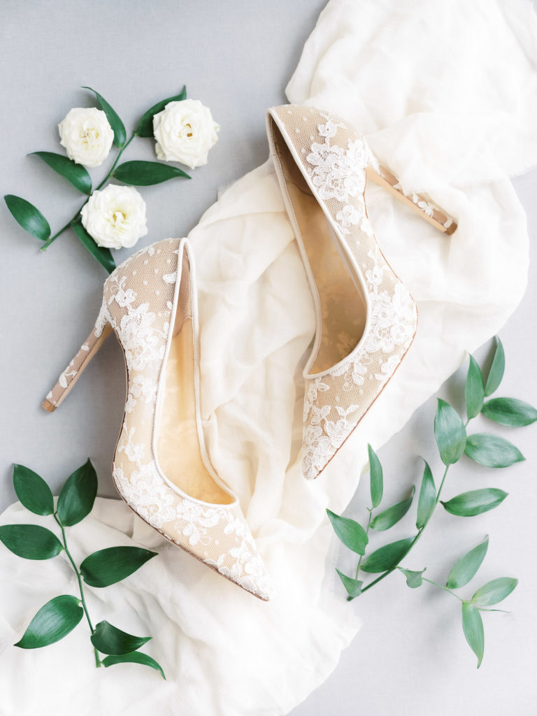 A detail photograph of Katie's Jimmy Choo shoes on the morning of her Brecknock Hall wedding.