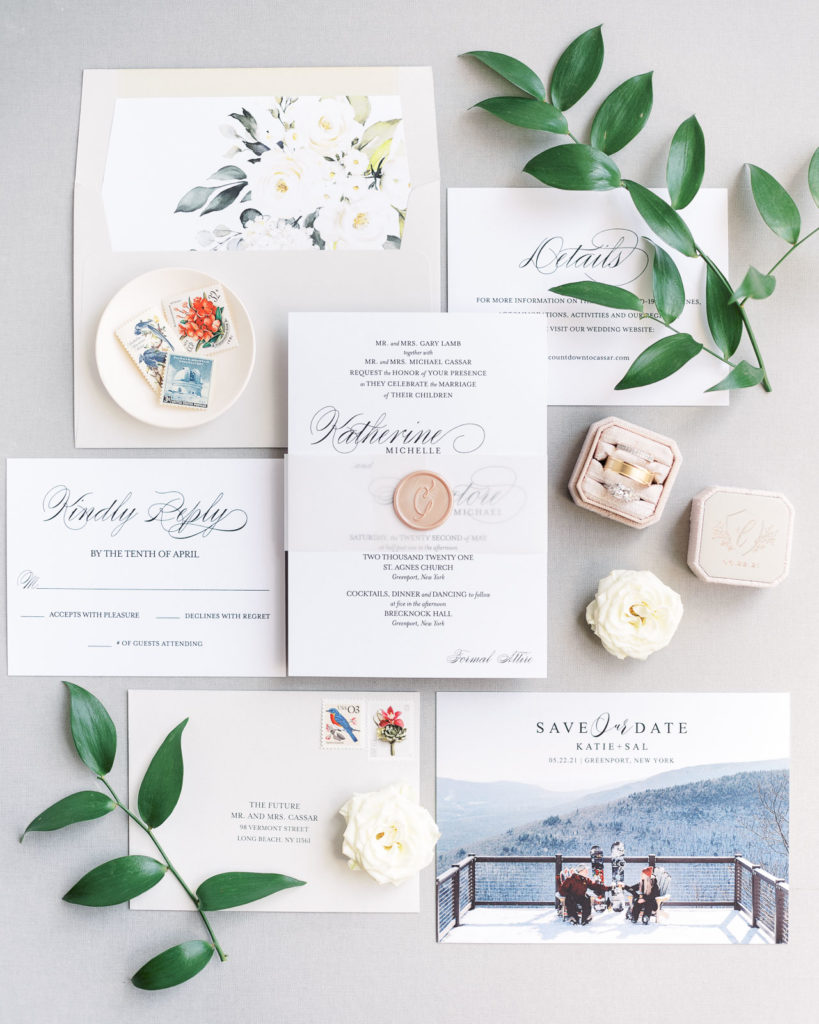 A photograph of Katie & Sal's invitation suite, styled by Tom Schelling Photography and taken the morning of their Brecknock Hall Wedding.