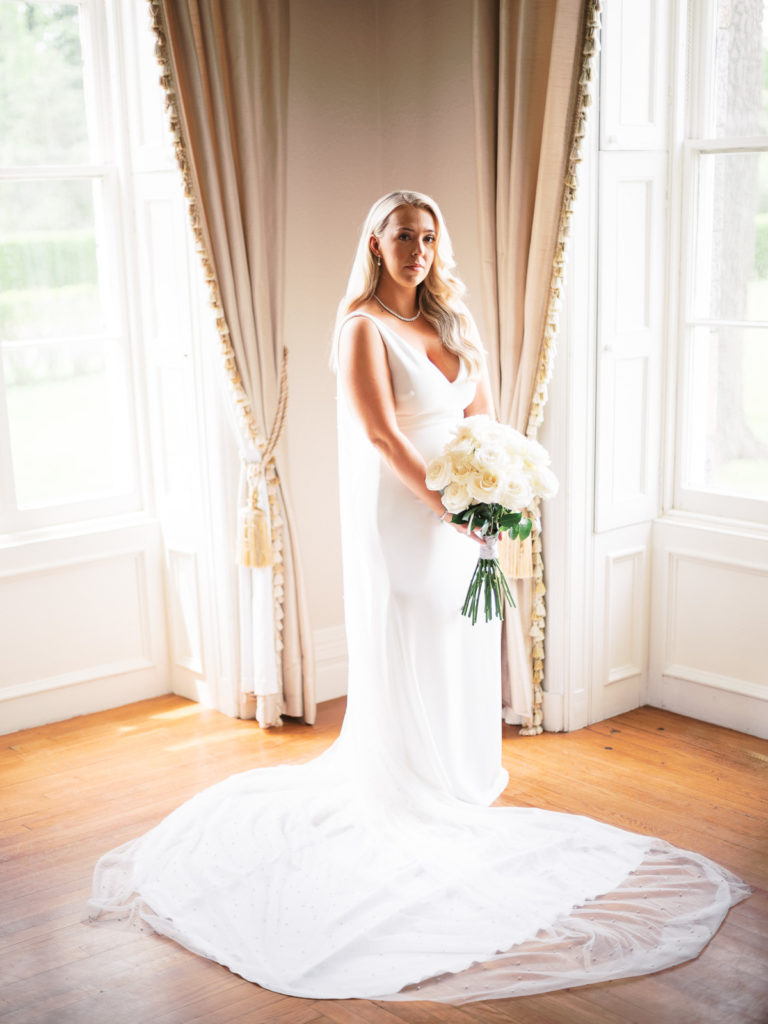A bridal portrait; the bride wearing Pronovias and holding a bouquet made by Kim Jon designs.