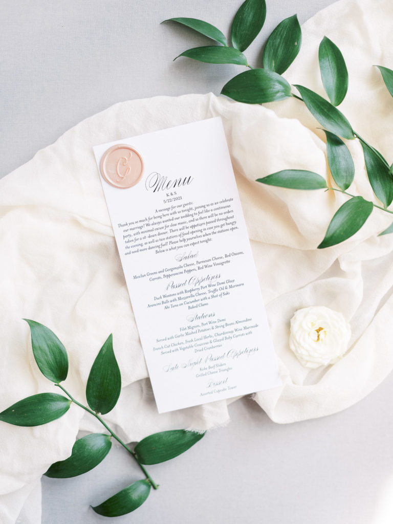Detailed menu cards taken by Tom Schelling Photography during a Brecknock Hall wedding.