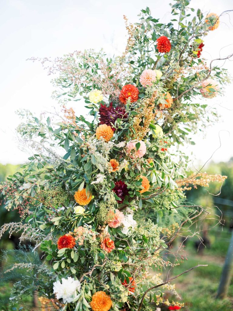 Stunning Arch designed by Hometown flower co for an RGNY Long Island Vineyard Wedding.