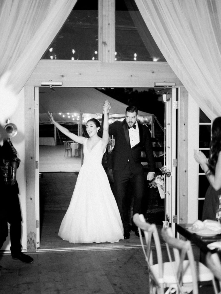 Bride and groom enter barn at RGNY.