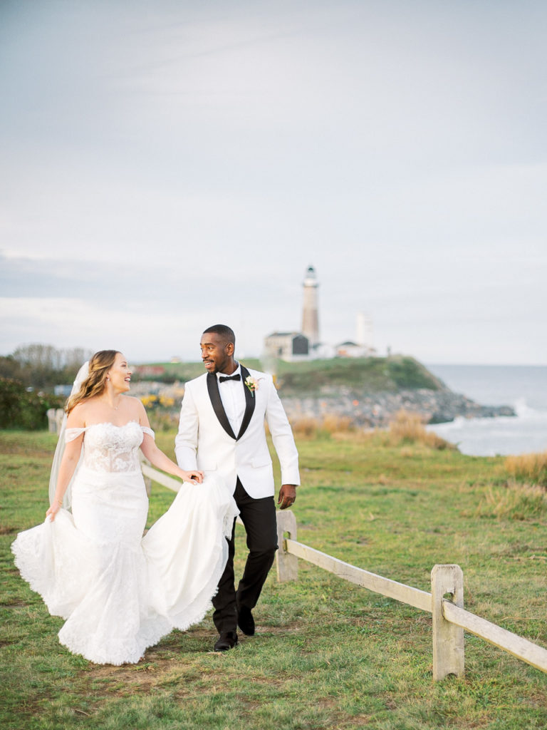 Bride and groom walk together during their Montauk wedding.