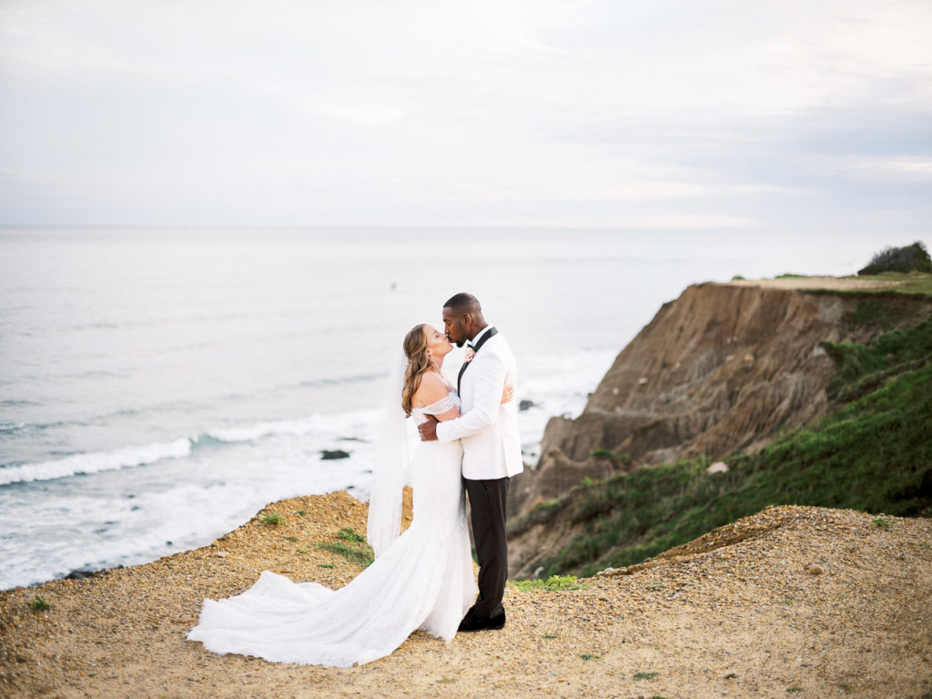 Photograph of bride and groom from Camp hero bluffs during their Montauk wedding.