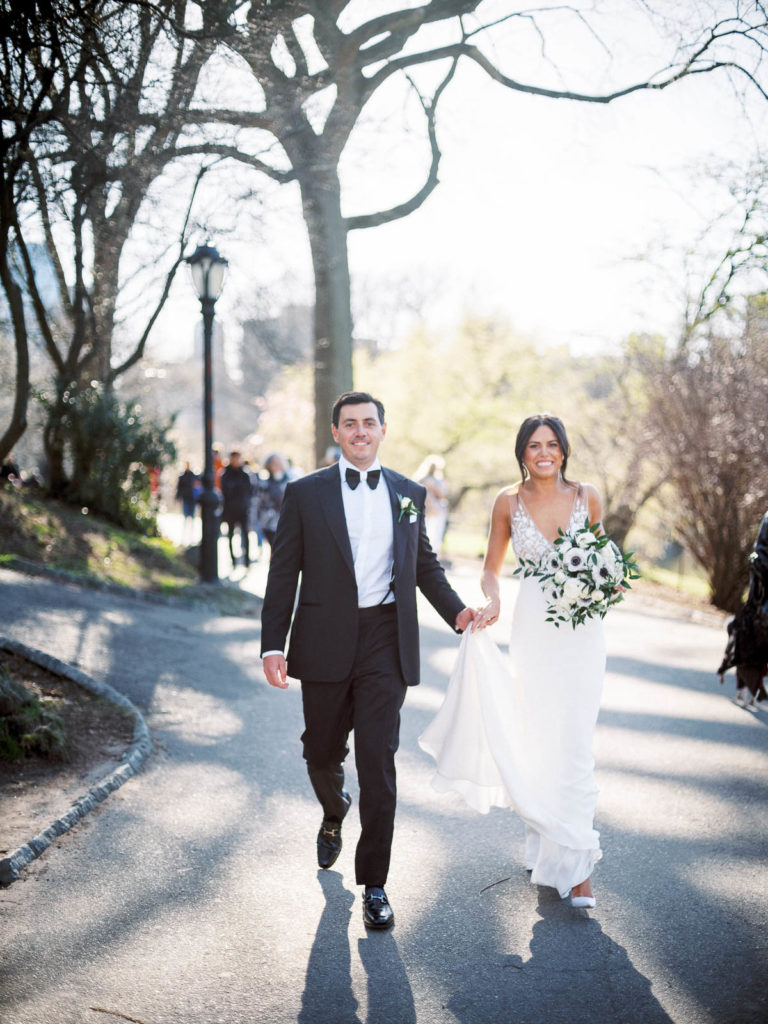 Bride & Groom walk together before The Central Park Boathouse Wedding.