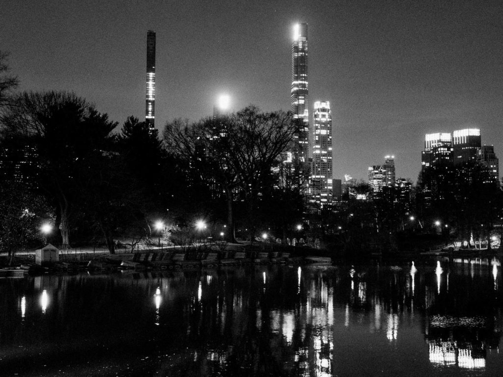The Central Park Boathouse Wedding NYC skyline at night.